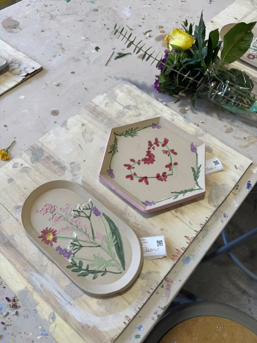 Hand-built clay trays imprinted with pressed flowers, made at a Colibri workshop